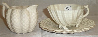 Lot 75 - Belleek cup, two saucers and a milk jug (4)