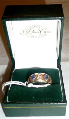 Lot 102 - A Victorian ring set with two old cut diamonds and a sapphire to each side, marks are worn and...