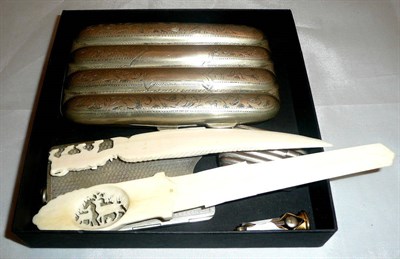 Lot 106 - A plated four division cigar case, vesta, cigar cutter, two carved ivory letter knives etc