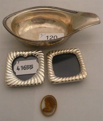Lot 120 - A classical cameo, two small photograph frames and a silver pap boat