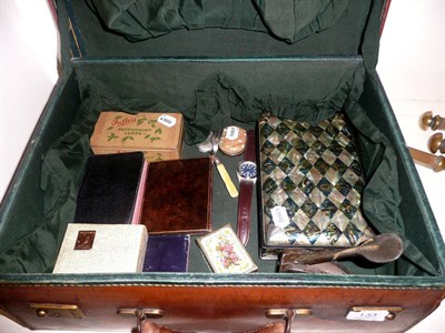Lot 133 - A leather travelling dressing case containing a small quantity of collectables including...