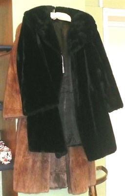 Lot 140 - A brown fur coat and black faux fur jacket