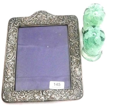Lot 145 - Pair of green glass dumps and a silver photo frame