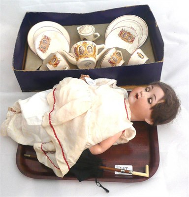 Lot 147 - AM bisque head doll and parasol and a boxed Wadeheath tea set