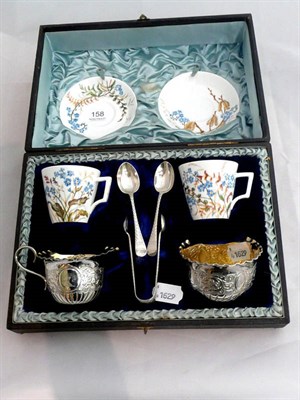 Lot 158 - A Victorian silver Tête à Tête set of sugar and cream, sugar tongs and two teaspoons...
