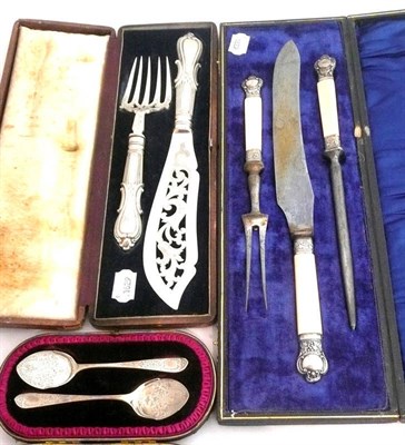 Lot 164 - A pair of silver preserve spoons - cased, a pair of plated fish servers - cased and a carving set 