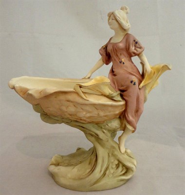 Lot 182 - A Continental figural centrepiece of a young lady seated by a shell