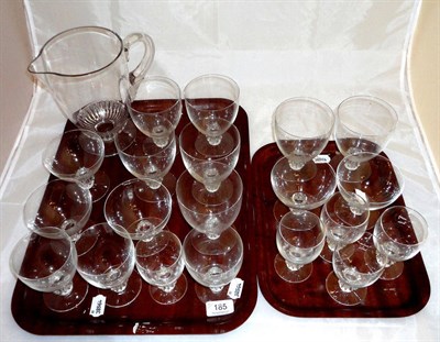 Lot 185 - A Lalique suite of glass, comprising; twenty glasses and a jug on two trays