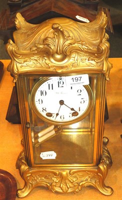 Lot 197 - A gilt metal mounted glass cased mantel clock