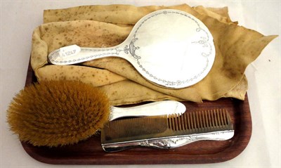 Lot 208 - A three piece silver mounted brush set