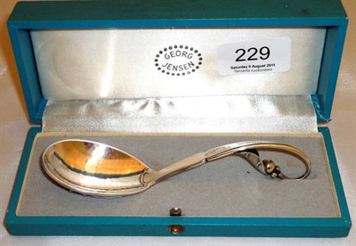 Lot 229 - A Georg Jenson silver spoon, in original case