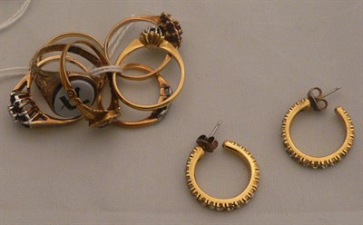 Lot 264 - Seven rings and a pair of earrings