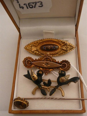 Lot 273 - A bird brooch, two Victorian brooches and a citrine stick pin