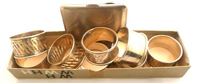 Lot 281 - Eight silver napkin rings (assorted and a silver cigarette case 1937)