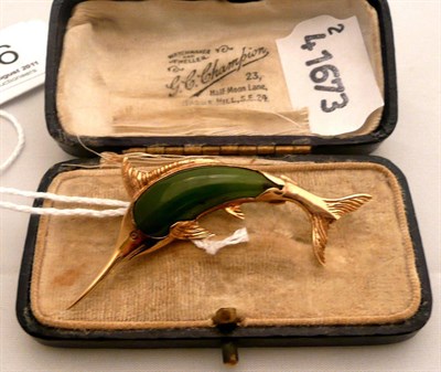 Lot 286 - A swordfish brooch set with jade, stamped '9ct'