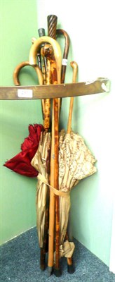 Lot 289 - Four Edwardian parasols and a collection of walking sticks