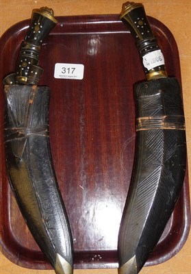 Lot 317 - Two Indian kukri's