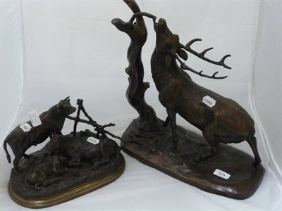 Lot 324 - Bronzed figure of a stag and a spelter group of three cattle (2)