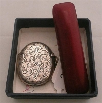 Lot 329 - A silver oval vesta case and a cased stock pin