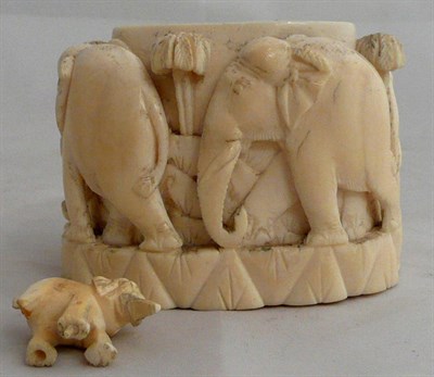 Lot 356 - Small ivory pot and cover carved with elephants