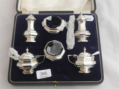 Lot 366 - A silver six piece condiment set comprising of two salts, two mustards and two pepper pots, cased