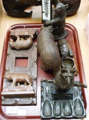 Lot 378 - A tray of five carved black forest bears including folding book stand, thermometer and a...