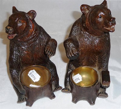 Lot 383 - Two similar black forest carved seated bears