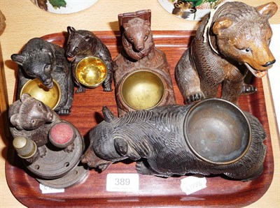 Lot 389 - Six assorted carved black forest bears including a pin cushion and pipe stand