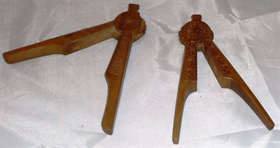 Lot 390 - Two carved treen nut crackers