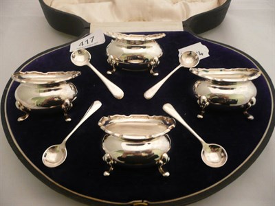 Lot 417 - A cased set of four silver salts and spoons, 6oz