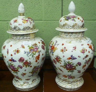 Lot 432 - A pair of continental floral decorated baluster vases and covers