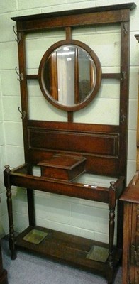 Lot 522 - Oak hall stand with a circular mirror