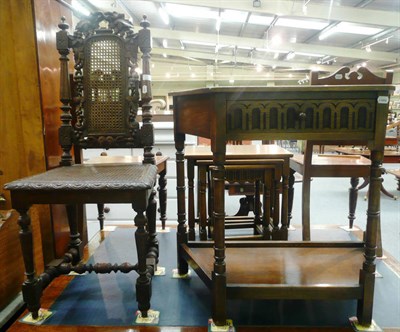 Lot 528 - Reproduction oak two tier side table and a carved side chair with caned seat and back