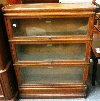 Lot 533 - A Globe Wernicke oak three tier stacking bookcase