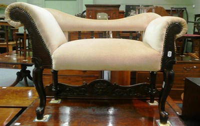 Lot 550 - Carved and ebonised window seat with cream velvet upholstery