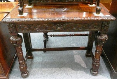 Lot 551 - Carved oak hall table