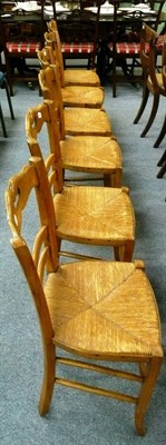 Lot 562 - A set of six rush-seated chairs