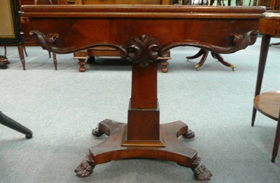 Lot 574 - A 19th century mahogany fold over centre table