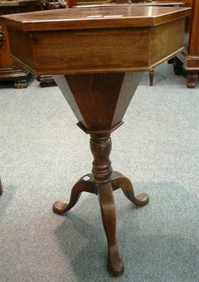 Lot 575 - An octagonal walnut inlay work table