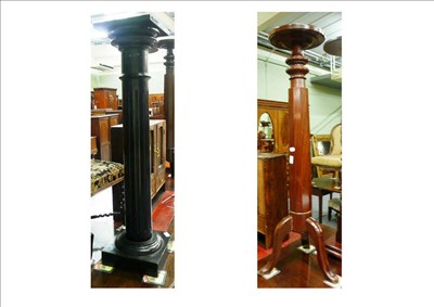 Lot 579 - A mahogany torchere stand on a tripod base and an ebonised torchere stand