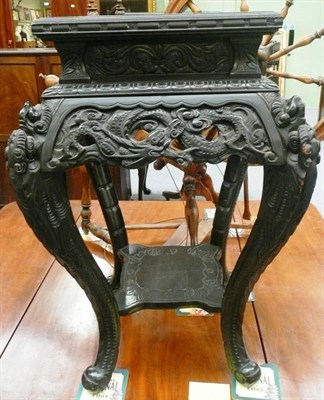 Lot 585 - An ebonized Chinese jardinere stand