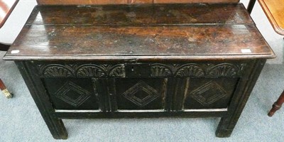 Lot 587 - An 18th century carved oak coffer