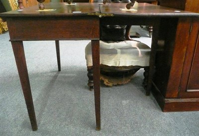 Lot 590 - A 19th century oak fold over tea table