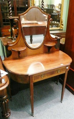 Lot 600 - An Edwardian mahogany inlaid dressing table with a shield shape mirror