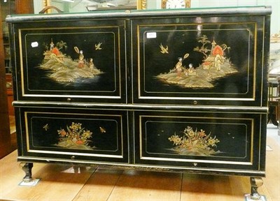 Lot 603 - A Chinese lacquered chest with four hinged doors