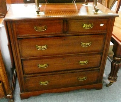 Lot 607 - An Edwardian walnut four height chest of drawers