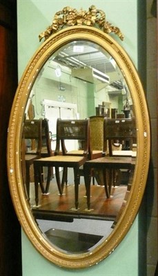 Lot 615 - A gilt framed oval wall mirror