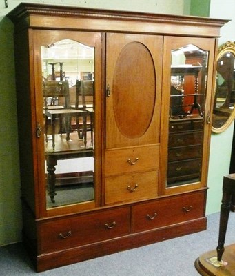 Lot 616 - An Edwardian mahogany inlaid triple wardrobe