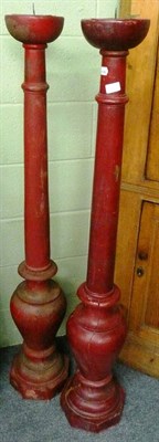 Lot 618 - Pair of red painted large pricket candlesticks