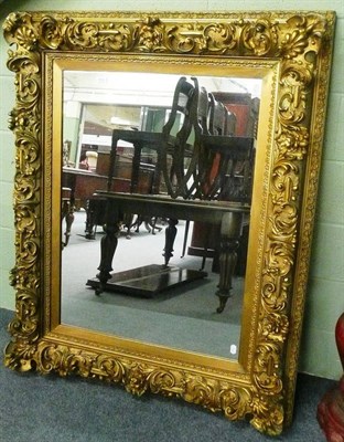 Lot 619 - A large gilt framed wall mirror